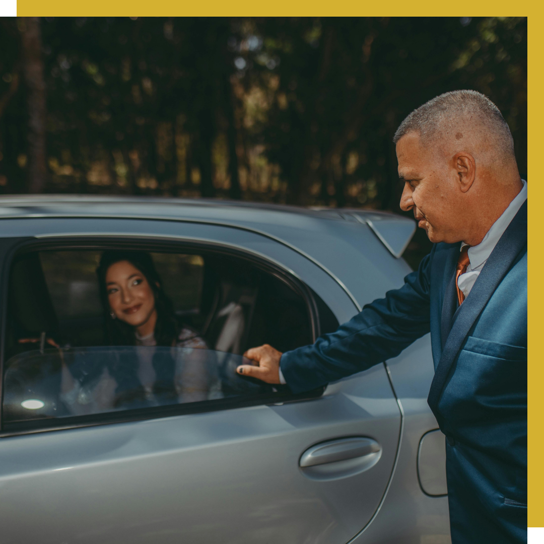 A chauffeur opening the door for a client